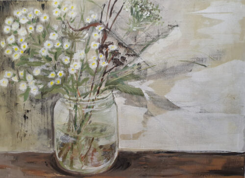 Flowers in a jar on grey background